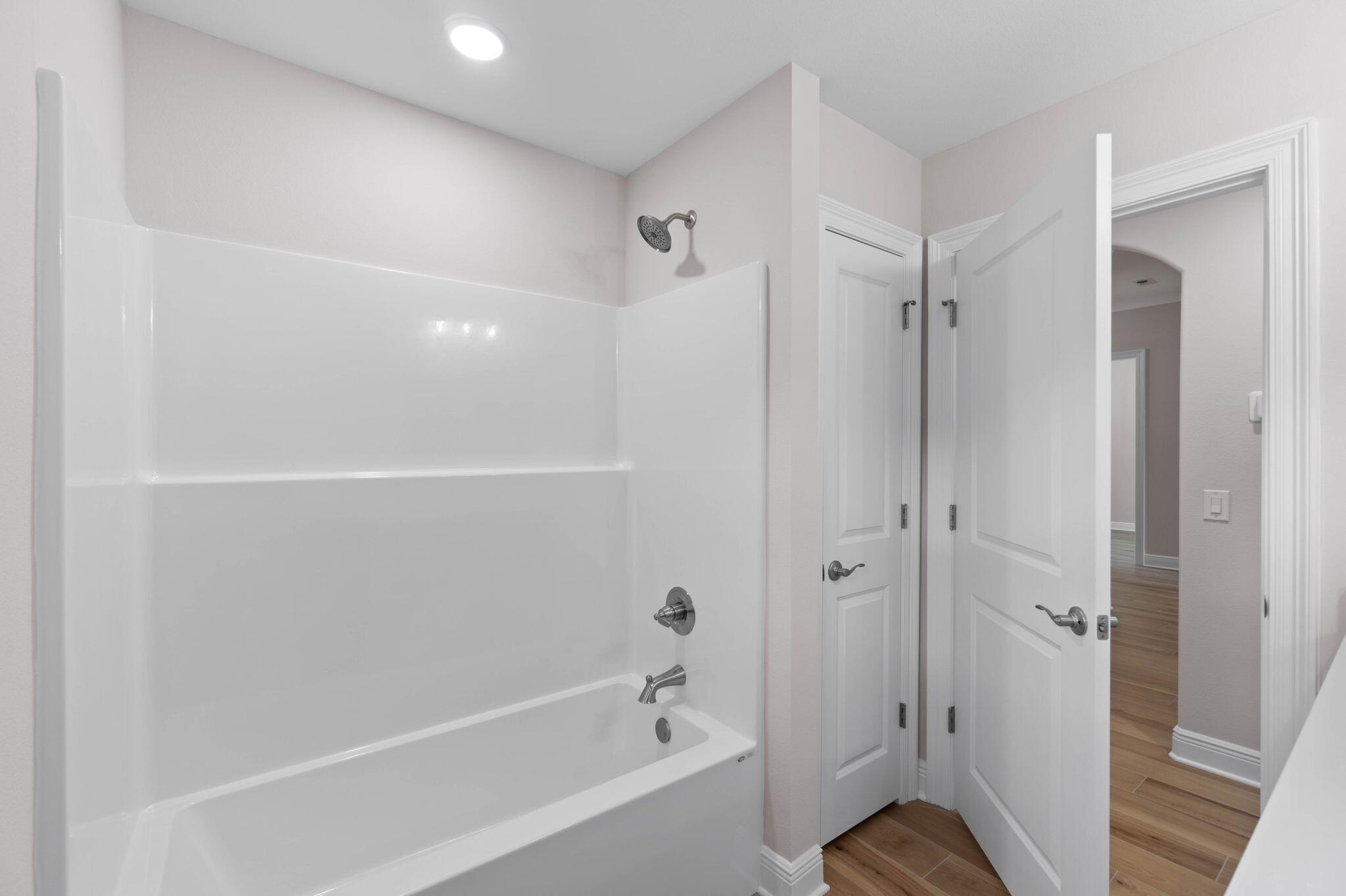 6752 Redfield Street Navarre, FL 32566 - Photo 33 of 64 a bathroom with a bathtub and a shower