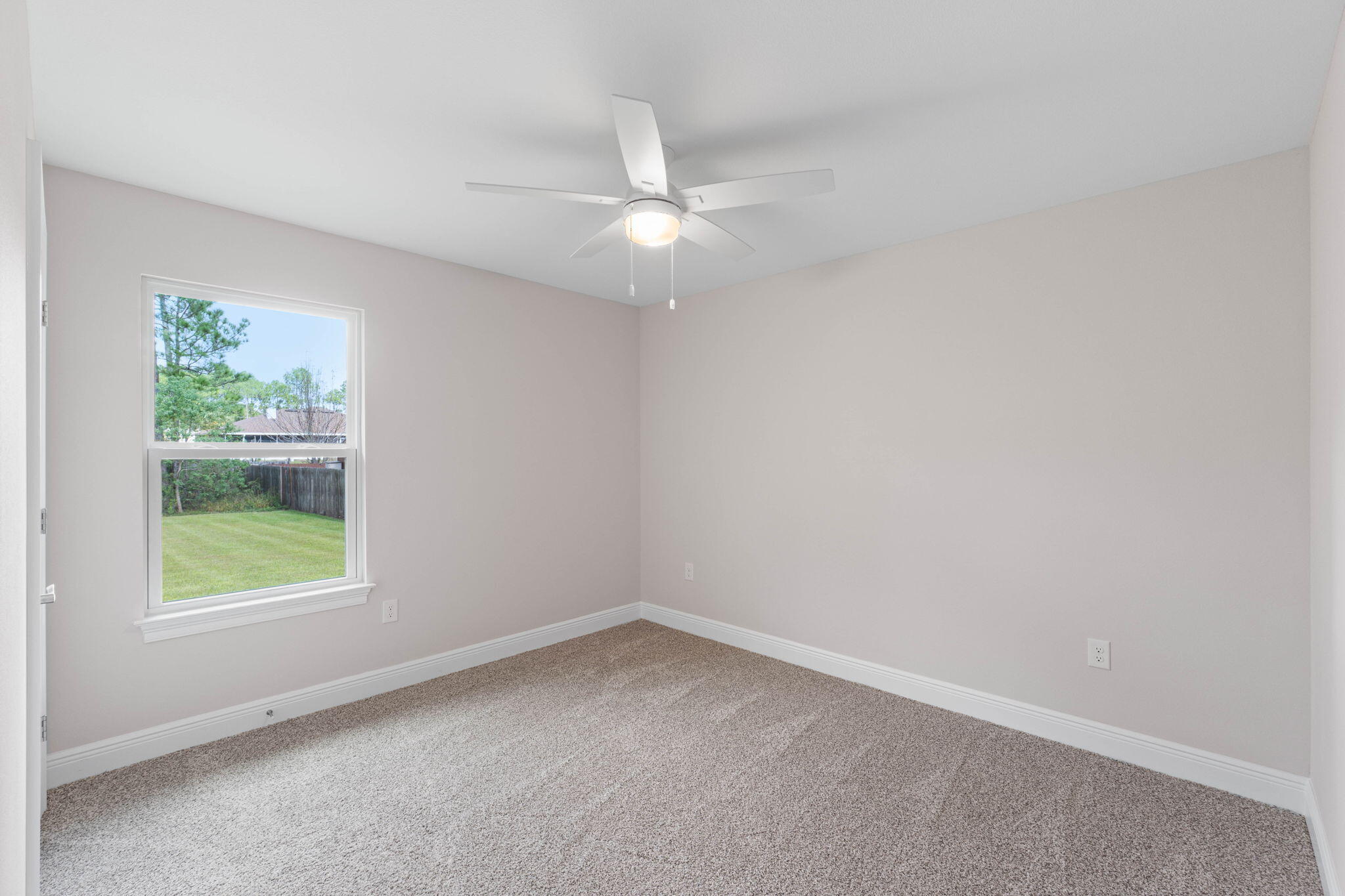 6752 Redfield Street Navarre, FL 32566 - Photo 38 of 64 an empty room with a window