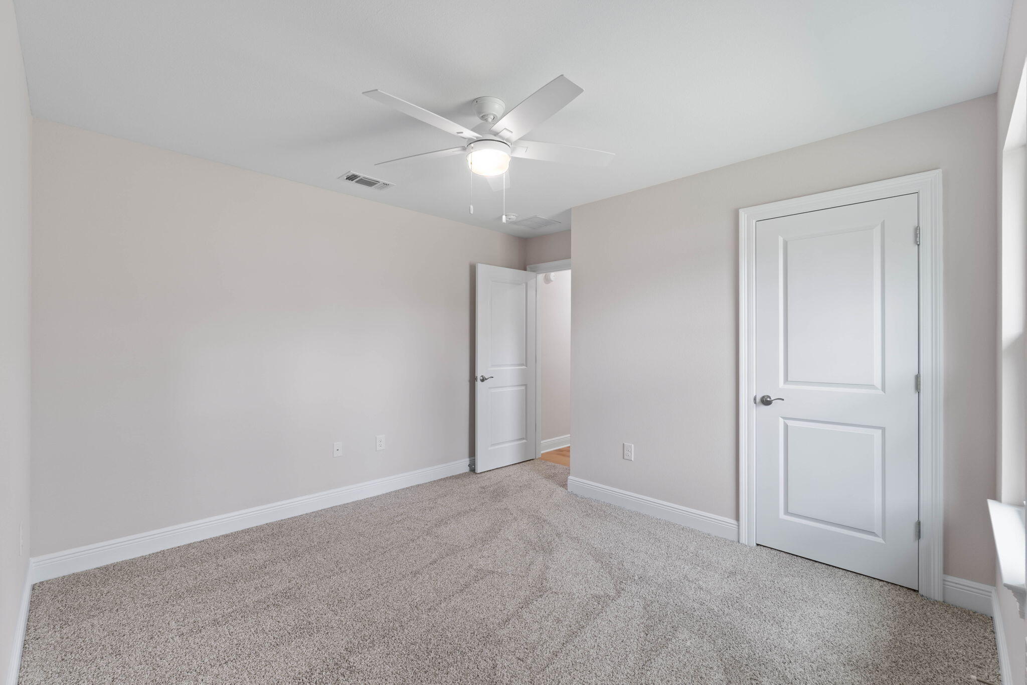 6752 Redfield Street Navarre, FL 32566 - Photo 39 of 64 an empty room with closet and fan
