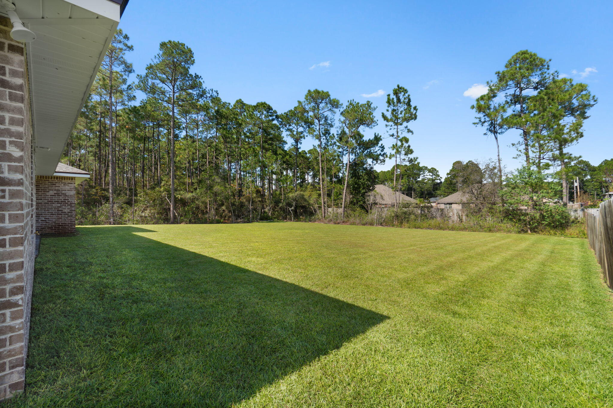 6752 Redfield Street Navarre, FL 32566 - Photo 43 of 64 a view of a yard
