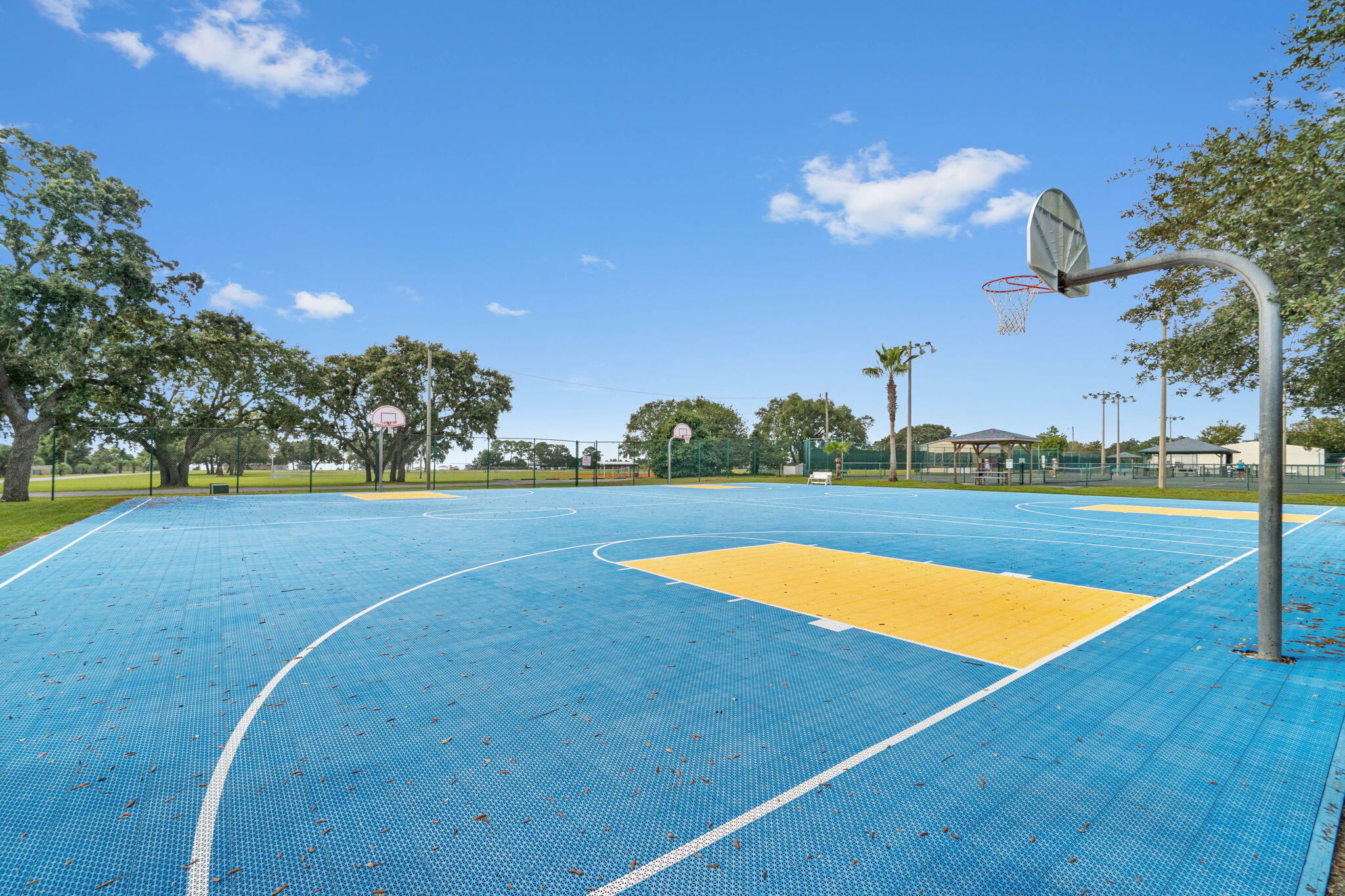 6752 Redfield Street Navarre, FL 32566 - Photo 58 of 64 a view of a basket ball ground and trees in the background