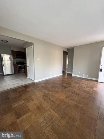 a view of an empty room with a stove