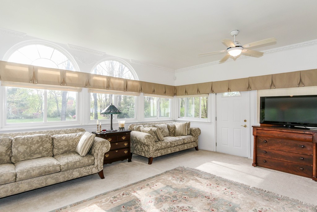 1016 Frank Smith Road Longmeadow, MA 01106 - Photo 11 of 28 a living room with furniture and a flat screen tv