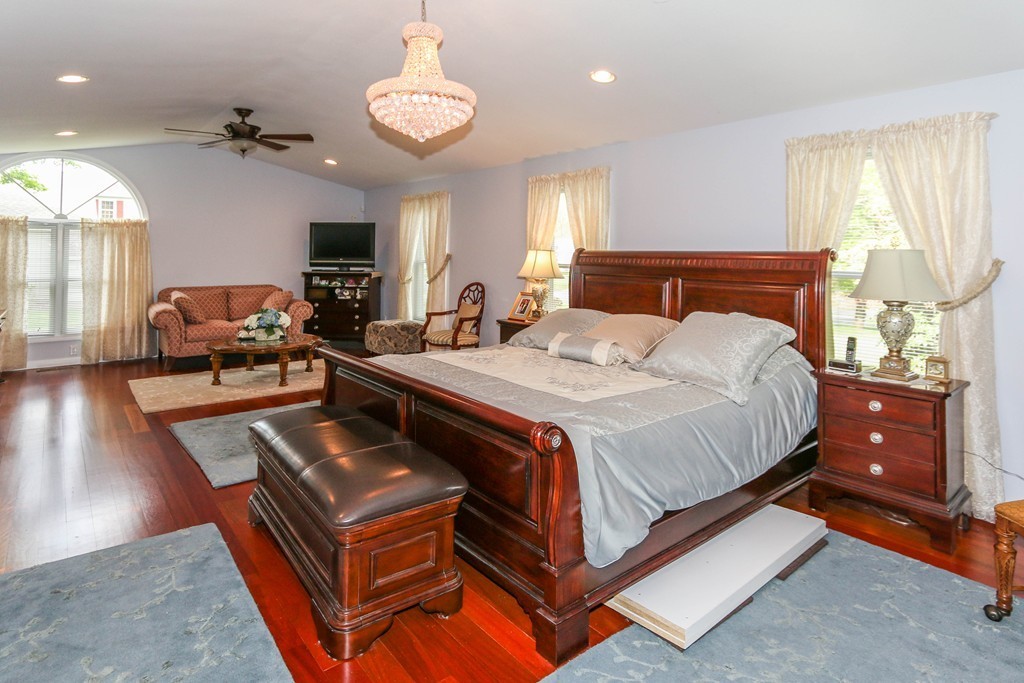 1016 Frank Smith Road Longmeadow, MA 01106 - Photo 15 of 28 a bedroom with a bed and wooden floor