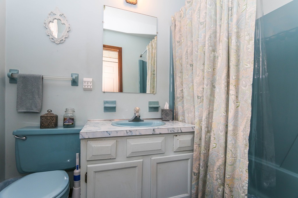 1016 Frank Smith Road Longmeadow, MA 01106 - Photo 20 of 28 a bathroom with a granite countertop sink toilet and mirror