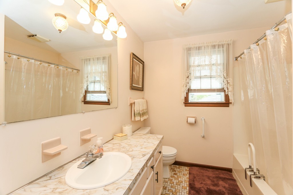 1016 Frank Smith Road Longmeadow, MA 01106 - Photo 21 of 28 a bathroom with a sink a vanity and a mirror