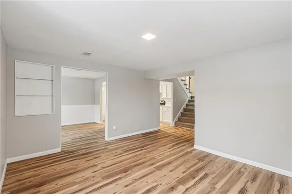 a view of wooden floor in an empty room
