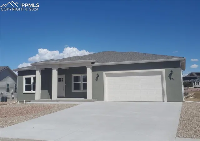 front view of a house with a garage