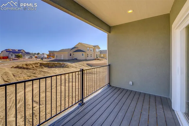 a view of a balcony with wooden floor