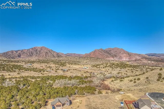 a view of a large building with a mountain in the background