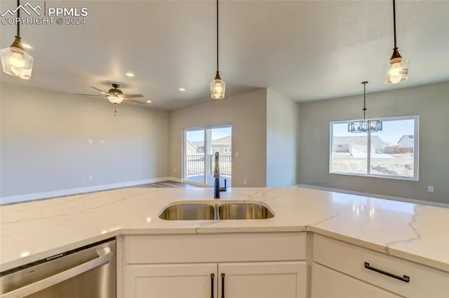 a kitchen with a sink cabinets and window