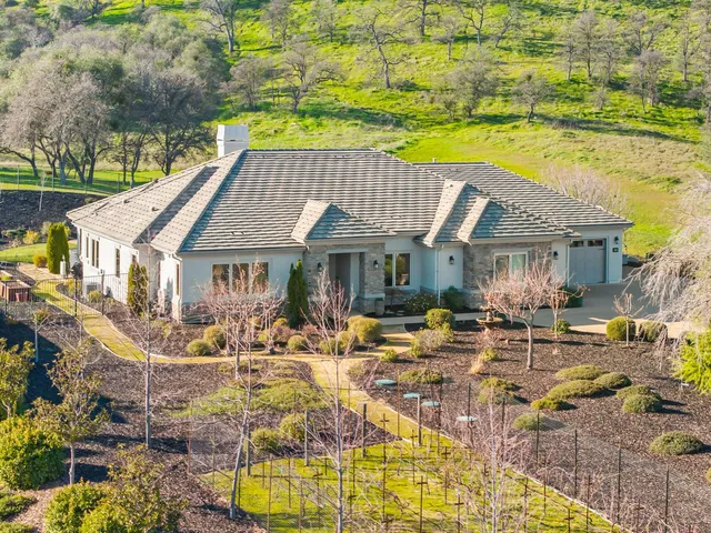 a view of house with outdoor space and swimming pool