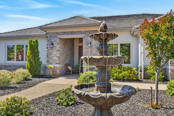 a front view of house with outdoor seating