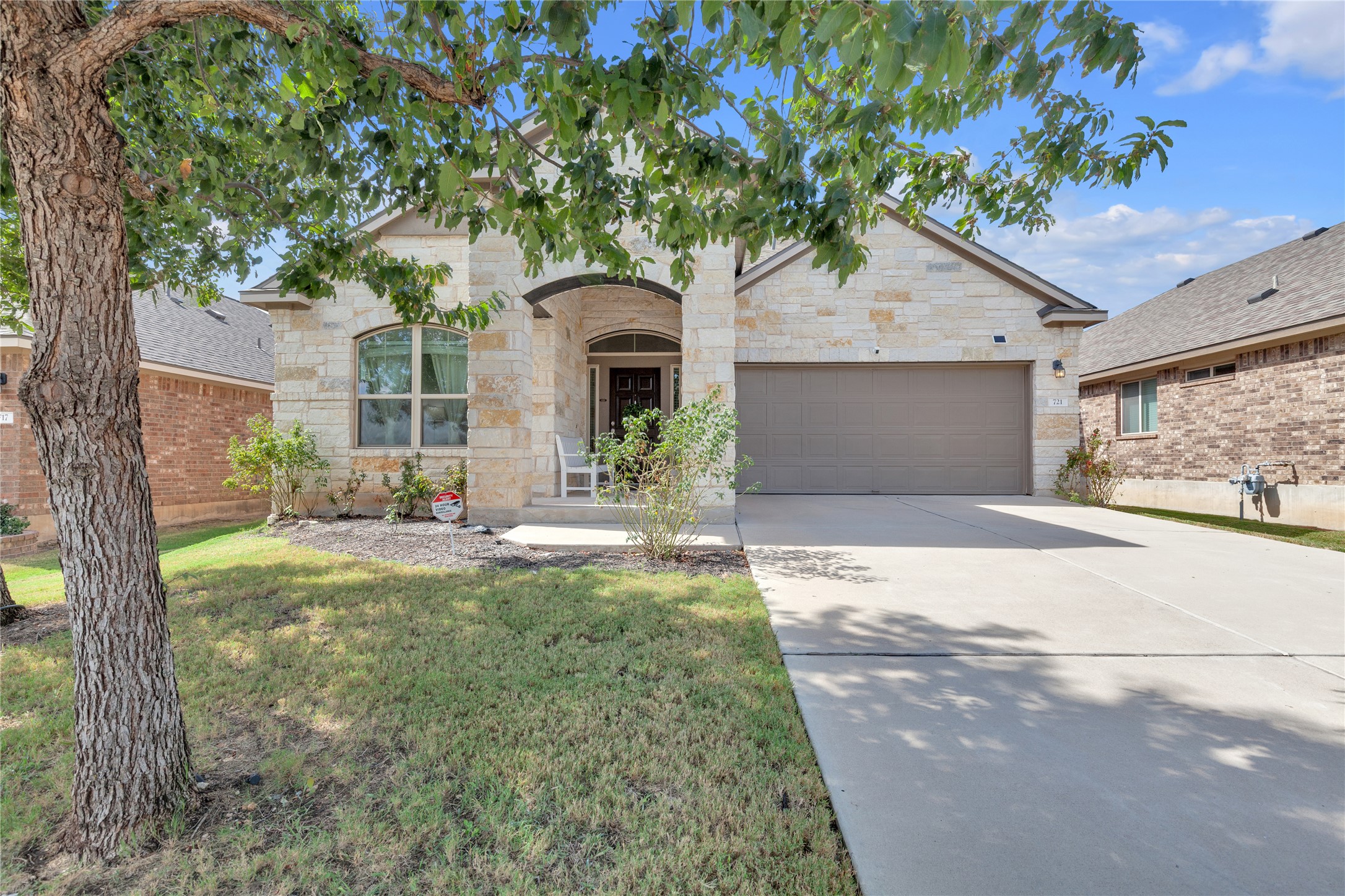 721 Schefer Street Leander, TX 78641 - Photo 1 of 38 a front view of a house with garden