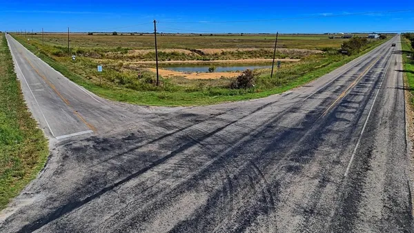 a view of a backyard with a ocean view