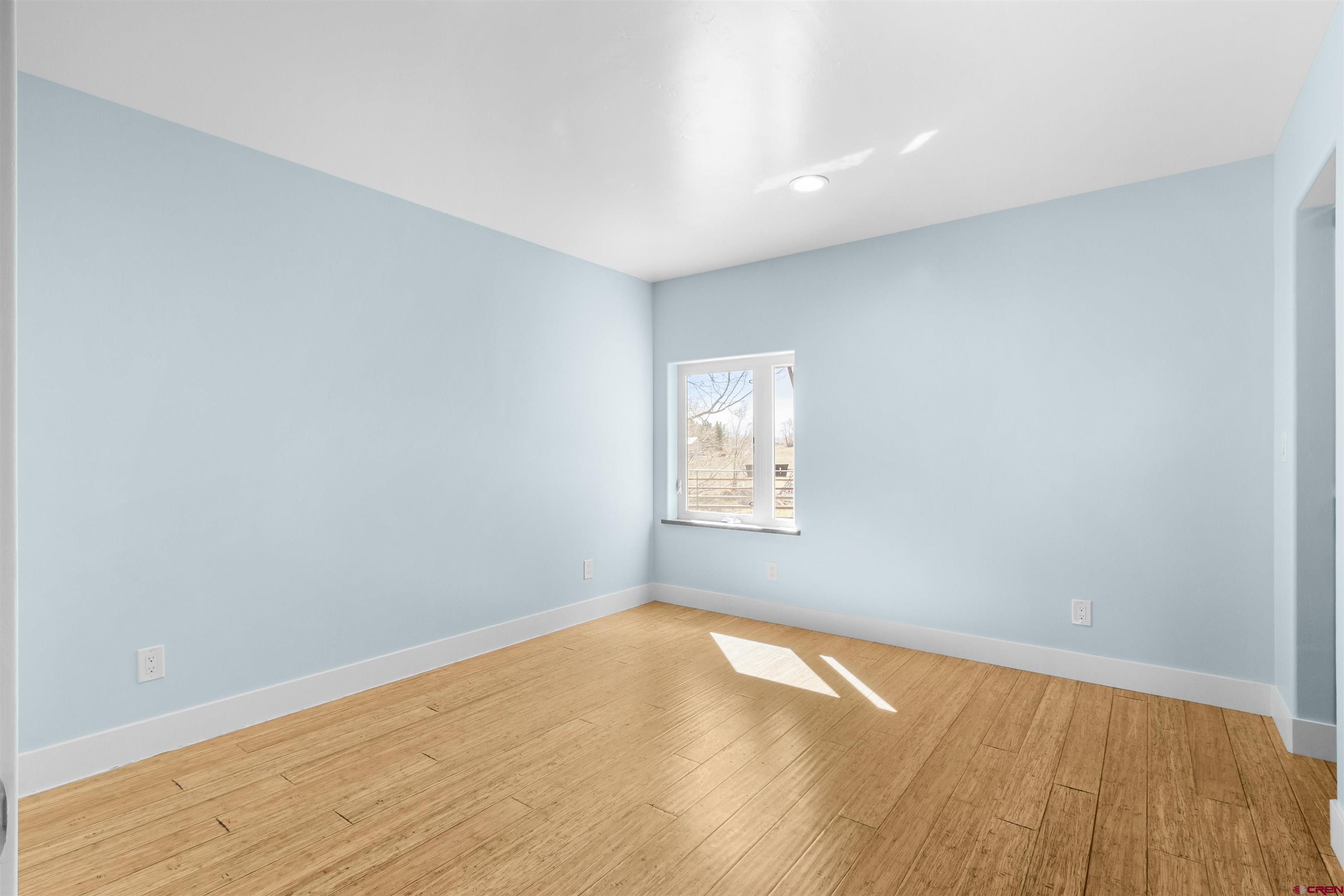 2192 Odelle Road Montrose, CO 81401 - Photo 24 of 45 a view of empty room with wooden floor