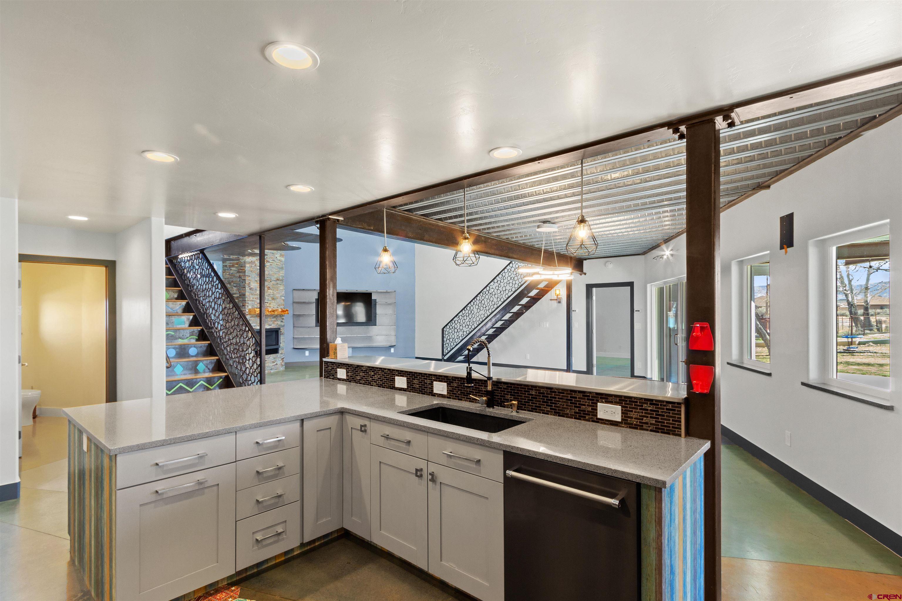 2192 Odelle Road Montrose, CO 81401 - Photo 7 of 45 a kitchen that has a lot of cabinets in it and wooden floor