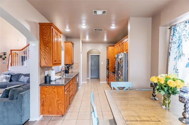 a lobby with furniture and a potted plant
