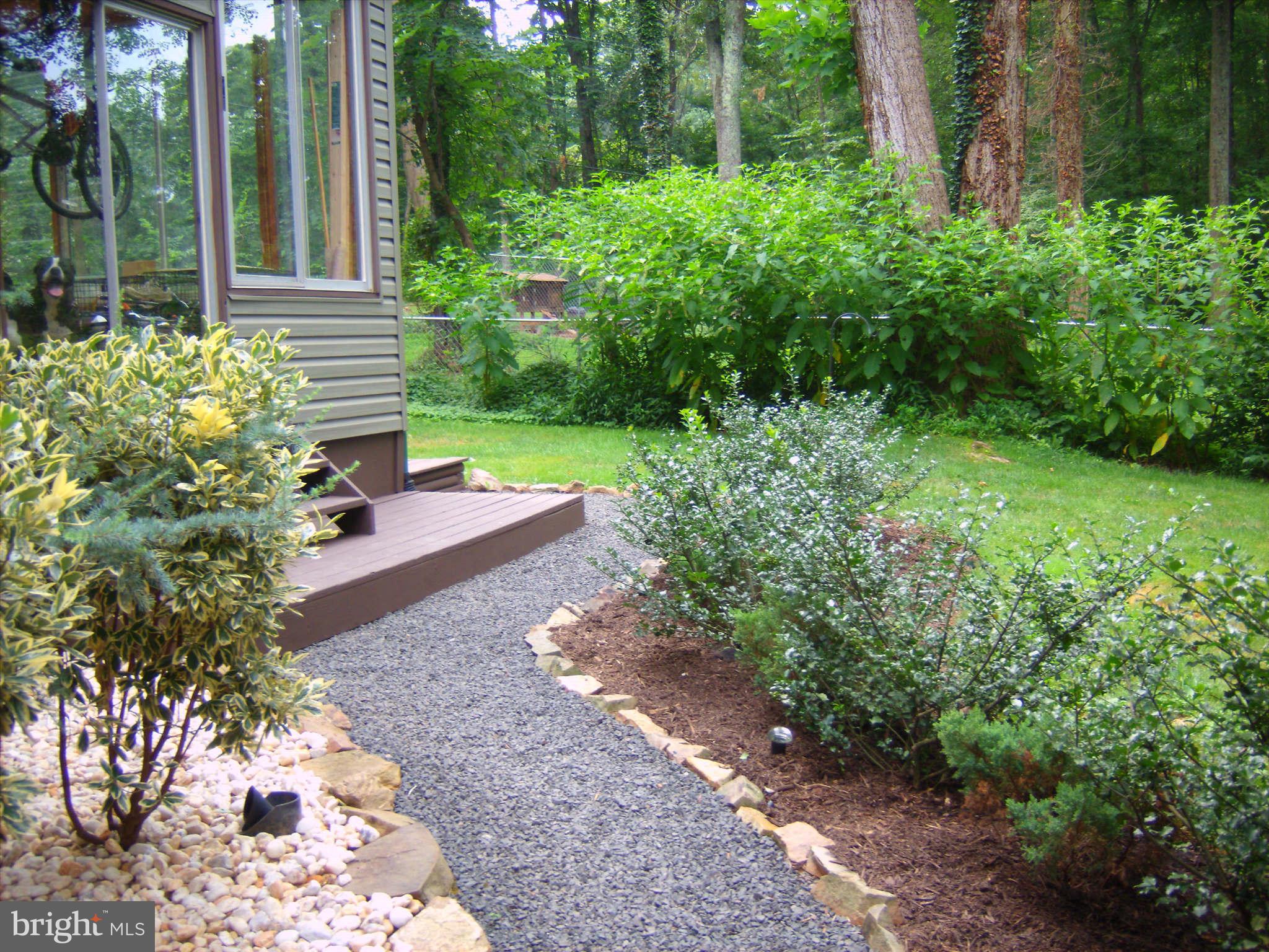 8151 Rogues Road Catlett, VA 20119 - Photo 2 of 24 Path from driveway to the enclosed porch