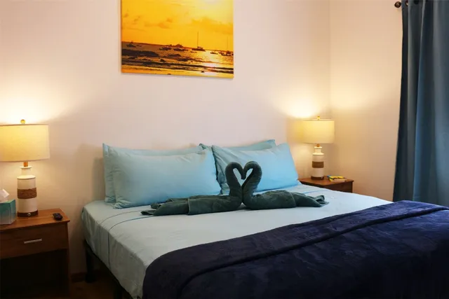 a bedroom with a bed and a lamp