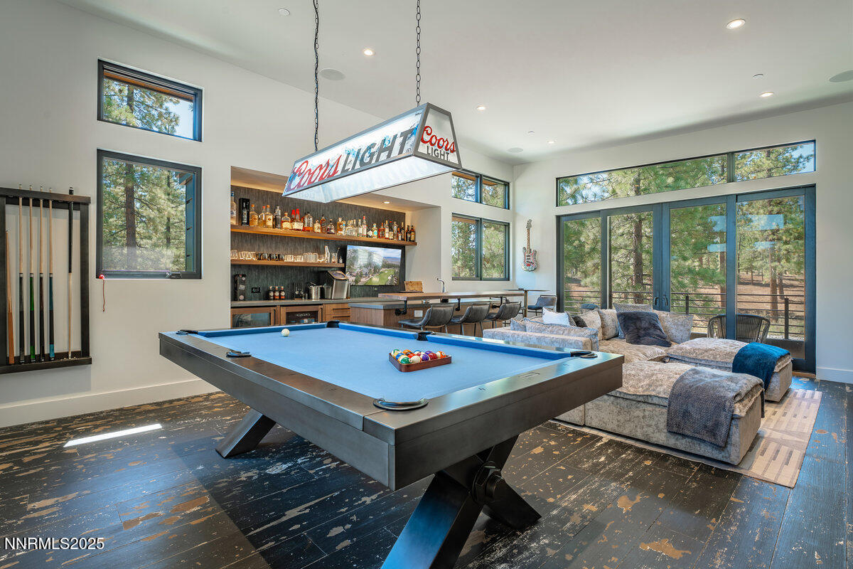 181 Redding Way Carson City, NV 89705 - Photo 23 of 40 a living room with furniture pool table and a large window