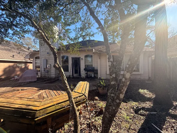 a view of a patio with chairs and a table