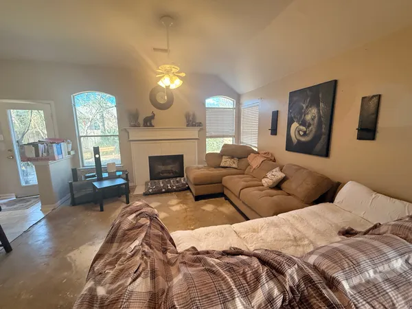 a bedroom with a bed and a fireplace