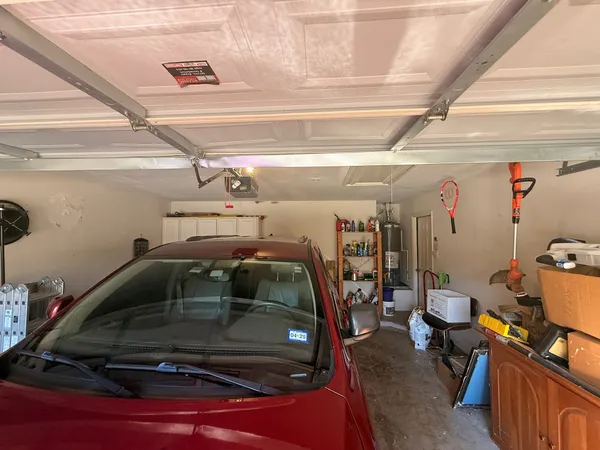 a view of parking garage with cars