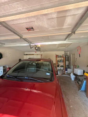 a view of parking garage with cars parked