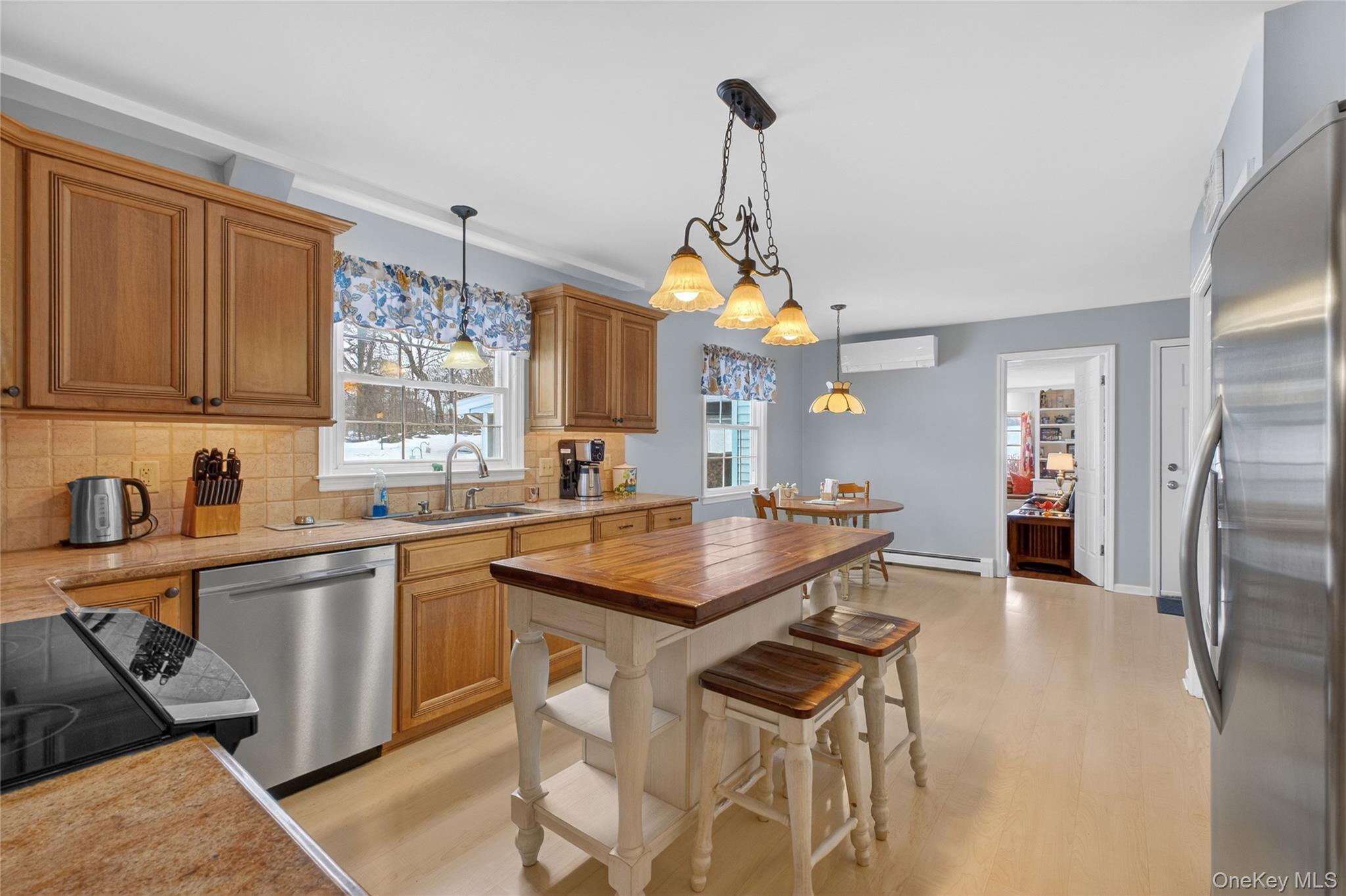 191 Forest Valley Road Pleasant Valley, NY 12569 - Photo 11 of 45 a kitchen with stainless steel appliances granite countertop a sink a stove and a table
