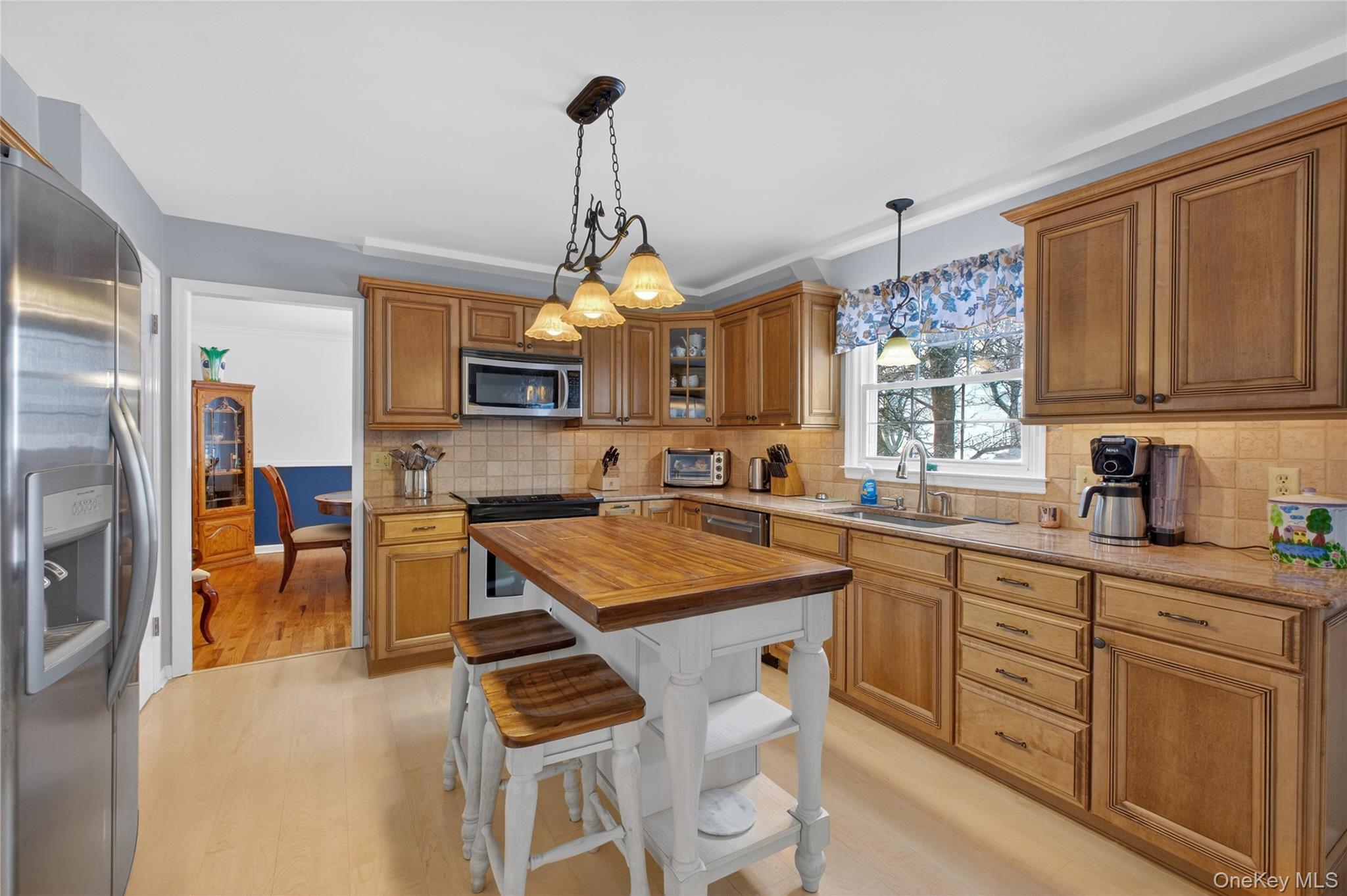 191 Forest Valley Road Pleasant Valley, NY 12569 - Photo 12 of 45 a kitchen with stainless steel appliances granite countertop a sink stove and refrigerator