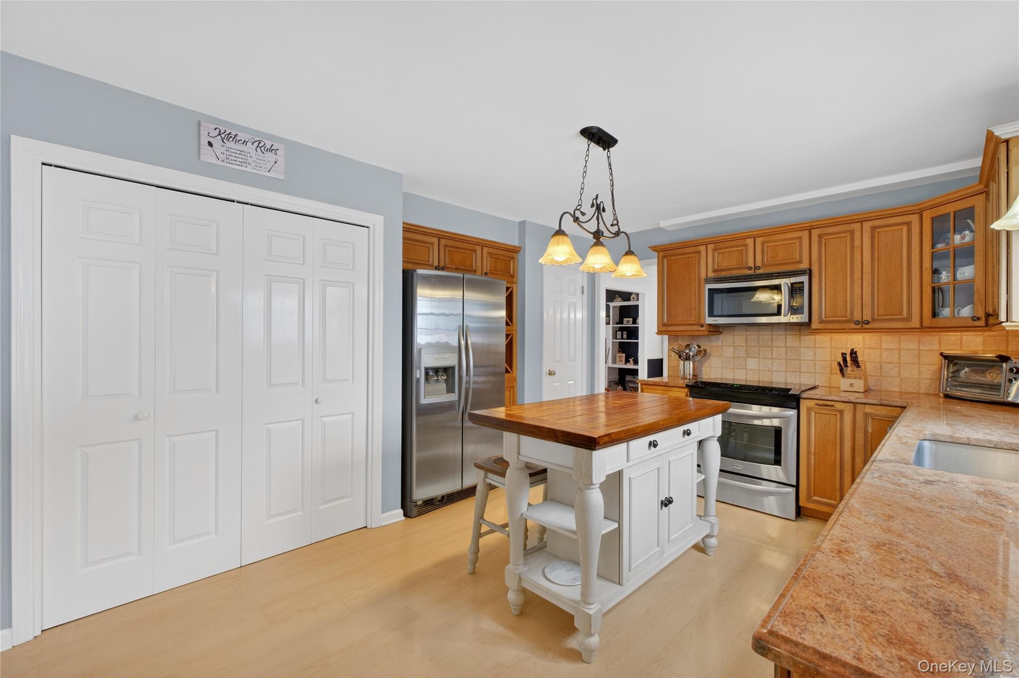 191 Forest Valley Road Pleasant Valley, NY 12569 - Photo 13 of 45 a kitchen with stainless steel appliances a stove refrigerator and a sink