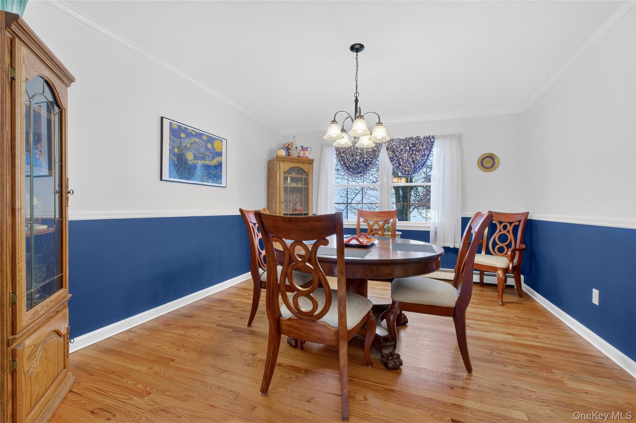 191 Forest Valley Road Pleasant Valley, NY 12569 - Photo 15 of 45 a view of a dining room with furniture a chandelier and wooden floor