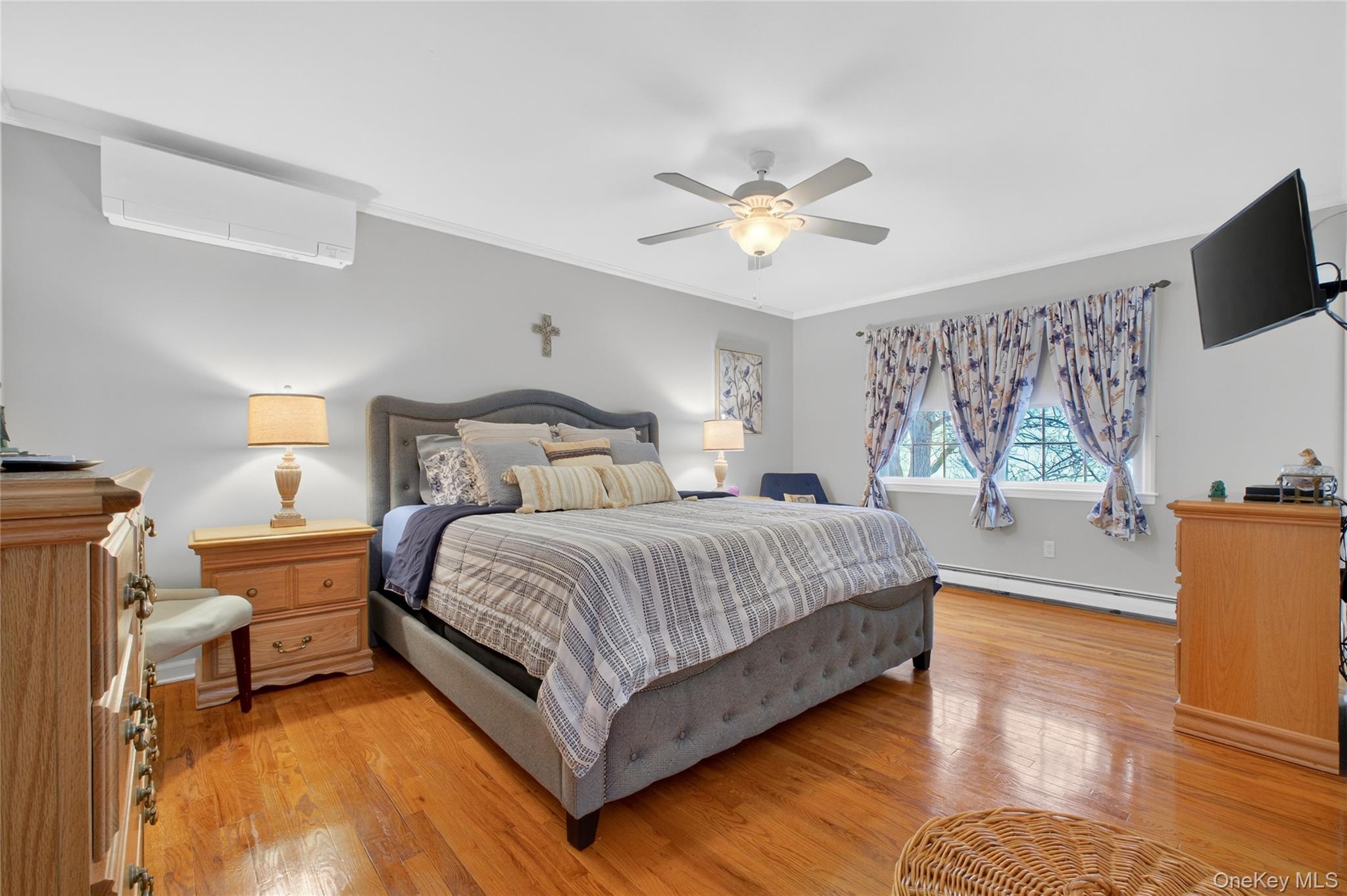 191 Forest Valley Road Pleasant Valley, NY 12569 - Photo 19 of 45 a bedroom with a bed and a flat screen tv