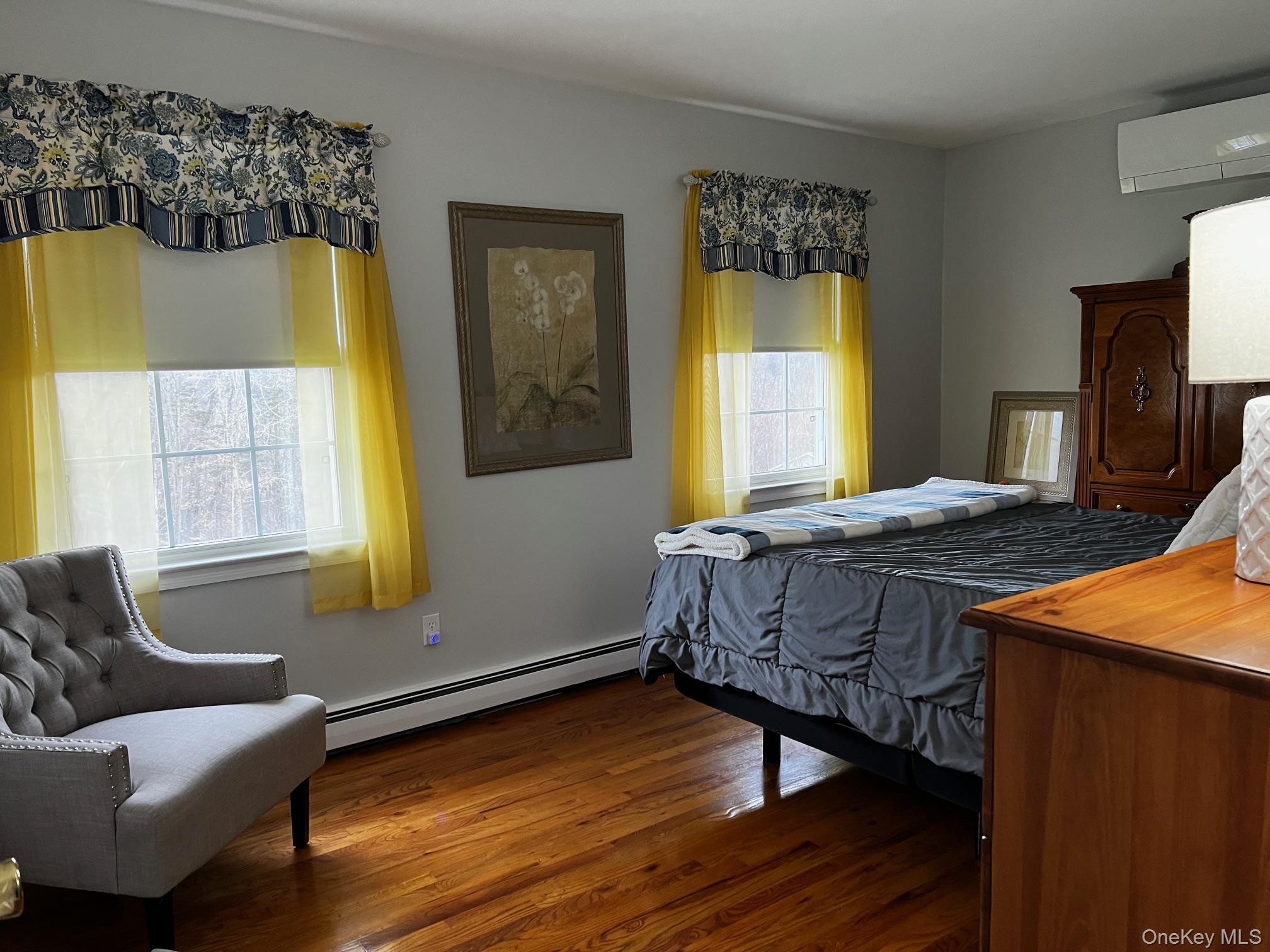 191 Forest Valley Road Pleasant Valley, NY 12569 - Photo 23 of 45 a bedroom with a bed and wooden floor