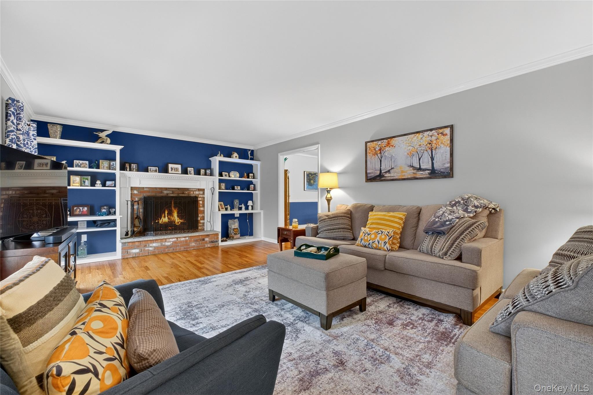 191 Forest Valley Road Pleasant Valley, NY 12569 - Photo 7 of 45 a living room with furniture a flat screen tv and a fireplace