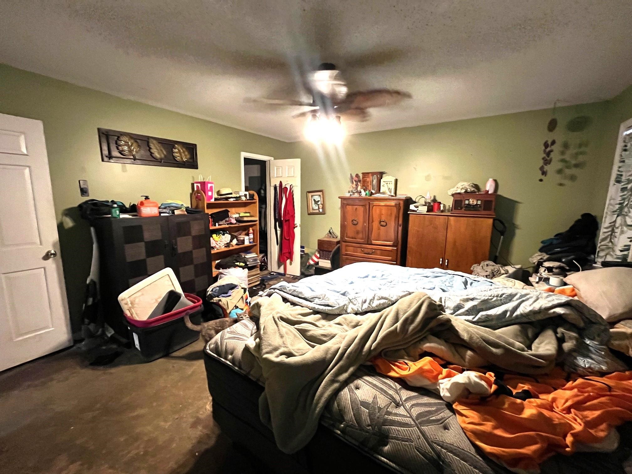 2467 Flowering Tree Drive Bartlett, TN 38134 - Photo 12 of 22 a bed room with a bed and a chair