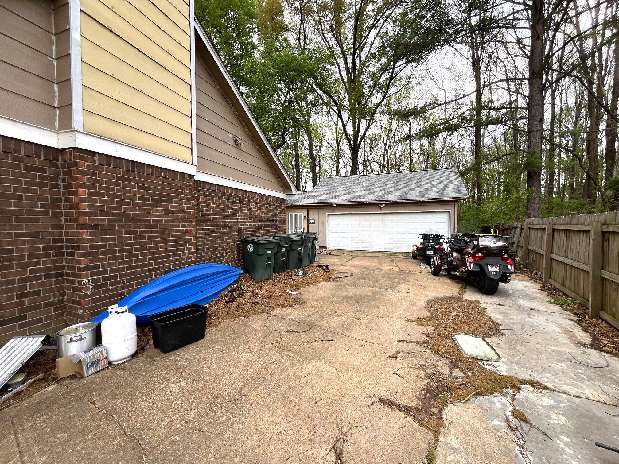 2467 Flowering Tree Drive Bartlett, TN 38134 - Photo 2 of 22 a view of a chair and table in the back yard of the house