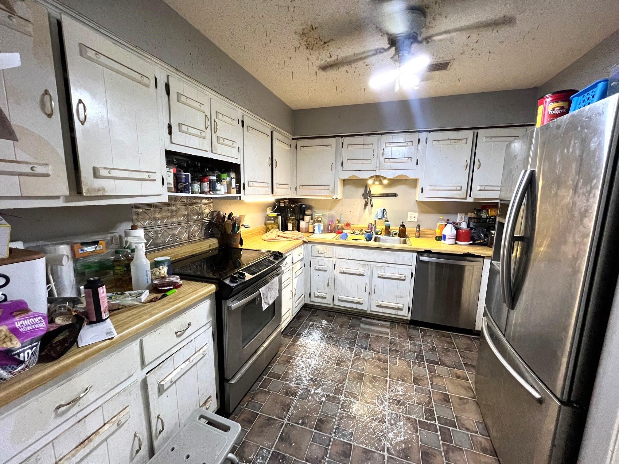 2467 Flowering Tree Drive Bartlett, TN 38134 - Photo 6 of 22 a kitchen with a sink stainless steel appliances and cabinets