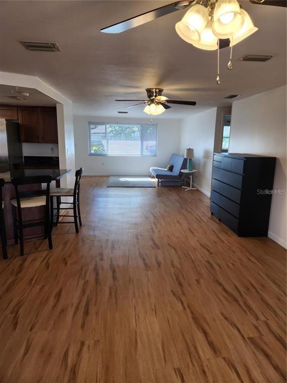 7021 Sonata Drive Port Richey, FL 34668 - Photo 3 of 14 a living room with furniture and a flat screen tv