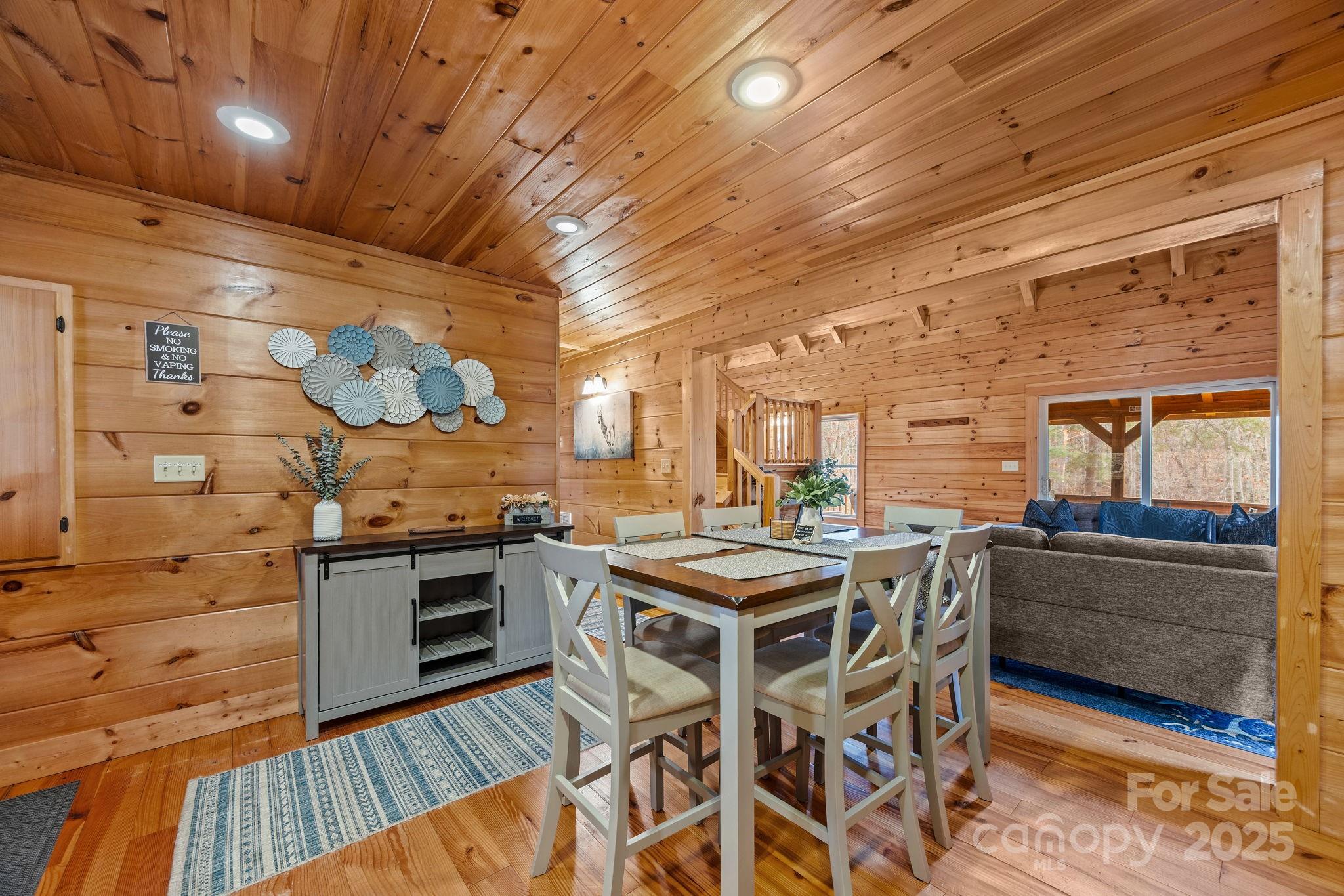 749 Buck Road Tryon, NC 28782 - Photo 12 of 45 a kitchen with stainless steel appliances granite countertop a stove and a wooden floors