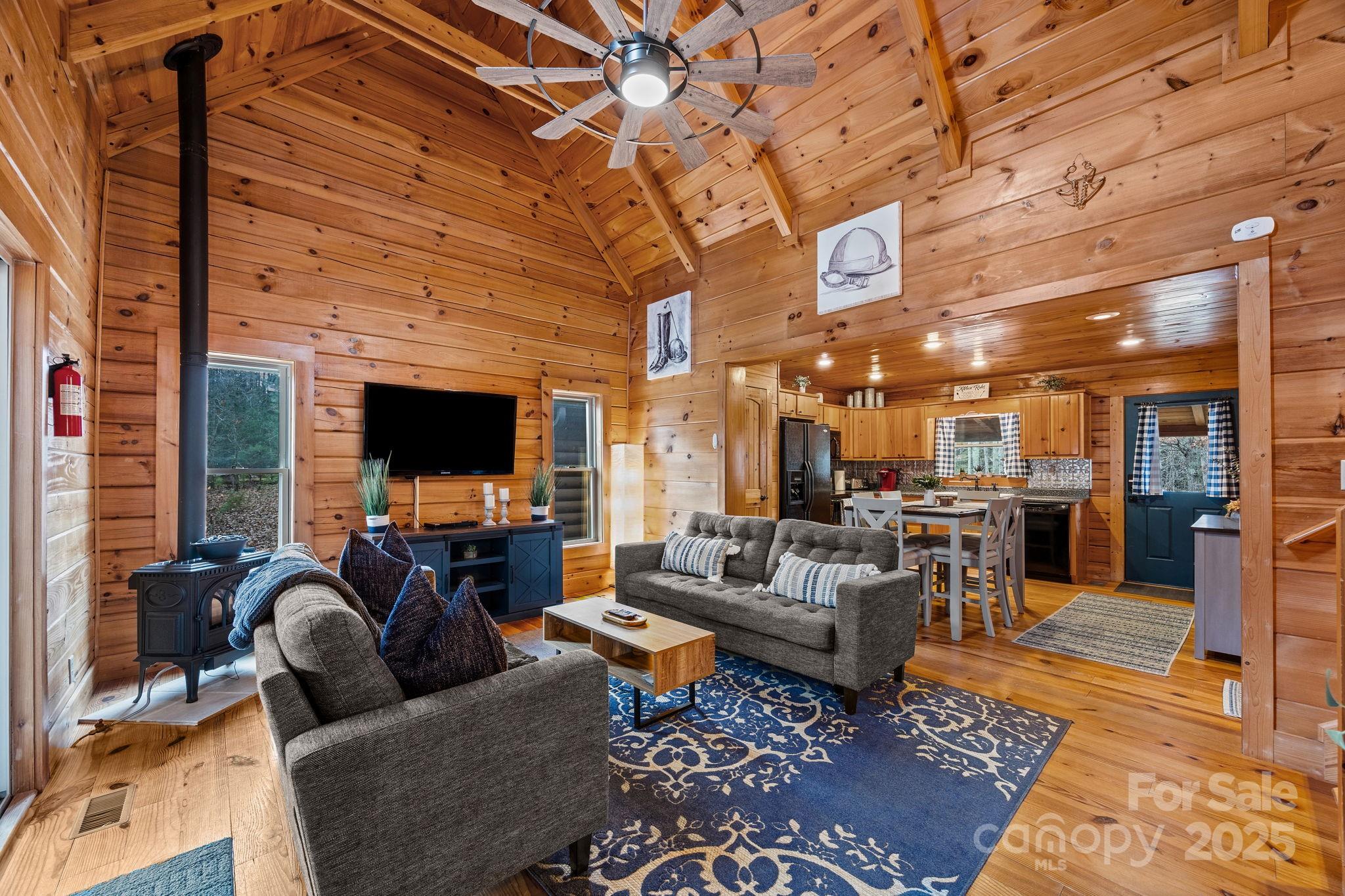 749 Buck Road Tryon, NC 28782 - Photo 14 of 45 a living room with furniture wooden floor and a flat screen tv