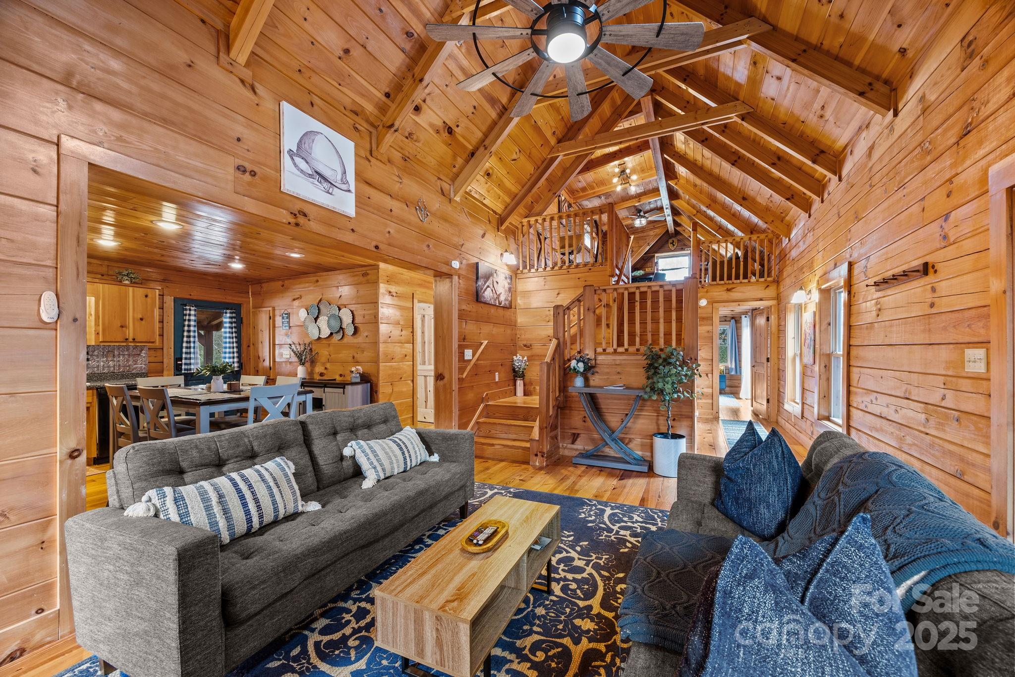 749 Buck Road Tryon, NC 28782 - Photo 15 of 45 a living room with lots of furniture and a rug