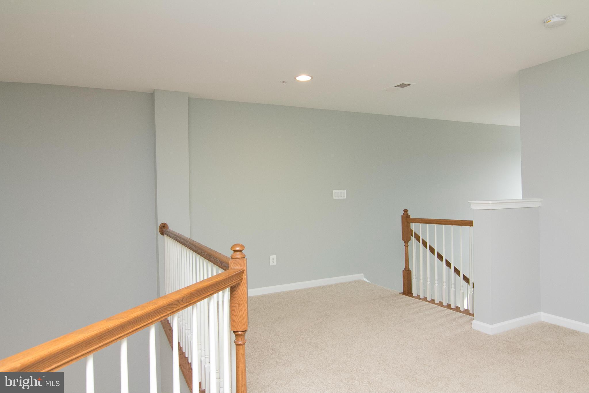 8485 Grove Angle Road, Unit 11 Ellicott City, MD 21043 - Photo 17 of 28 Large loft overlooks Living/Dining Area