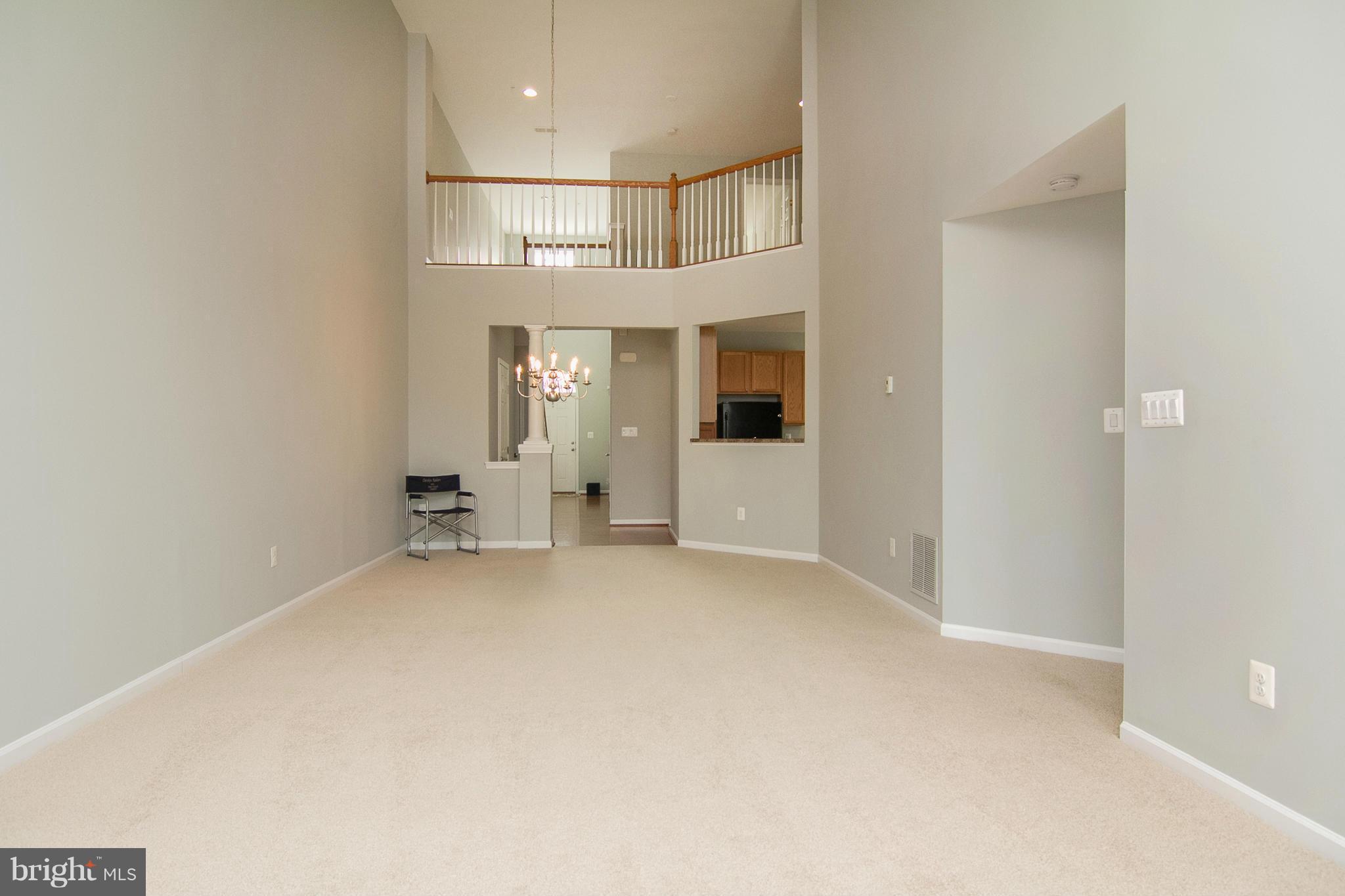 8485 Grove Angle Road, Unit 11 Ellicott City, MD 21043 - Photo 3 of 28 Living/Dining Area w/Vaulted Ceiling