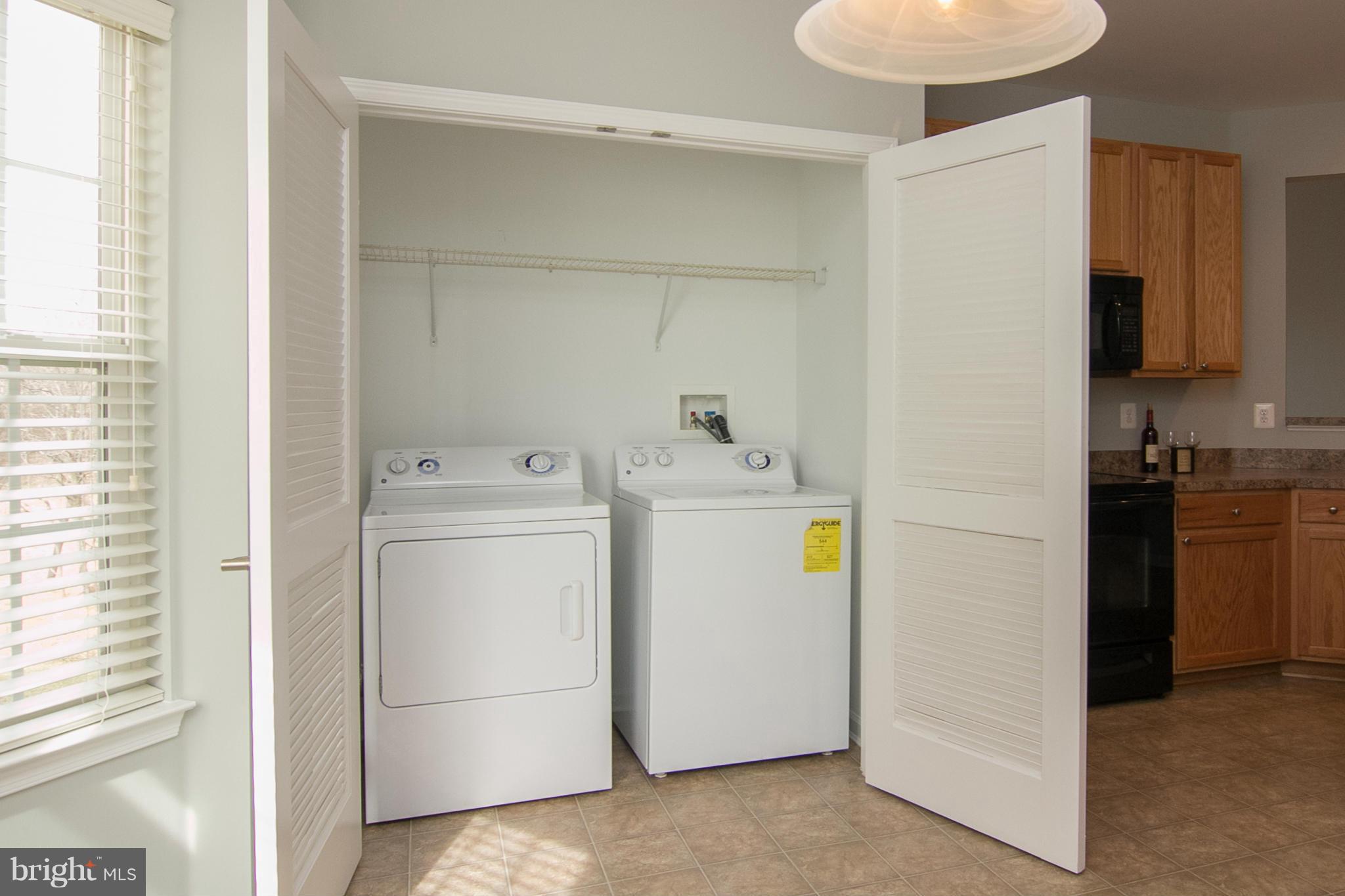 8485 Grove Angle Road, Unit 11 Ellicott City, MD 21043 - Photo 10 of 28 Laundry closet in spacious kitchen