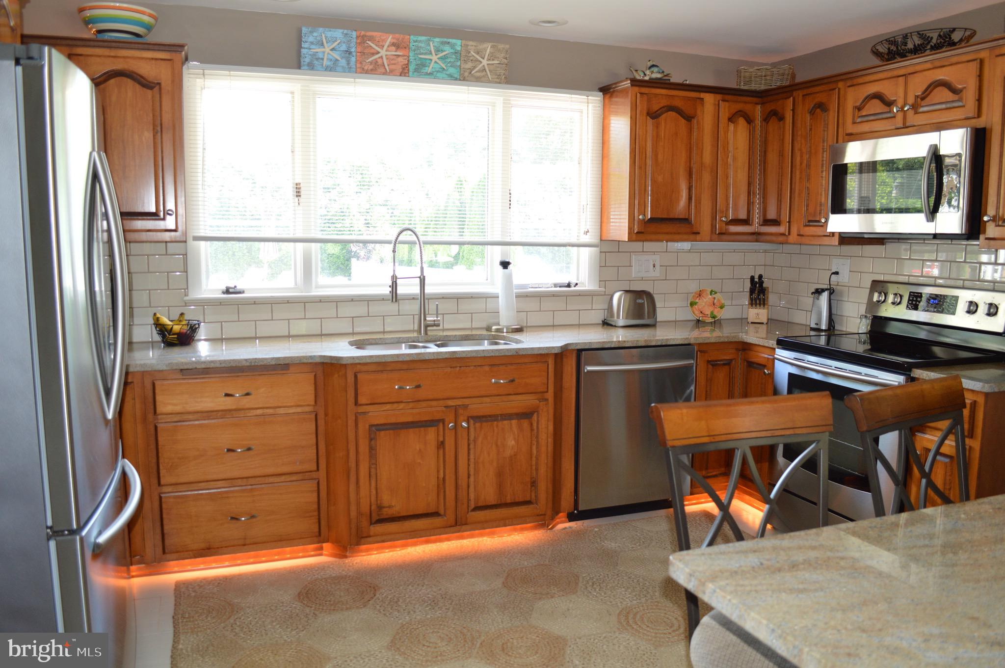 95 Russell Road Phoenixville, PA 19460 - Photo 3 of 37 Kitchen with granite counters and lighting feature