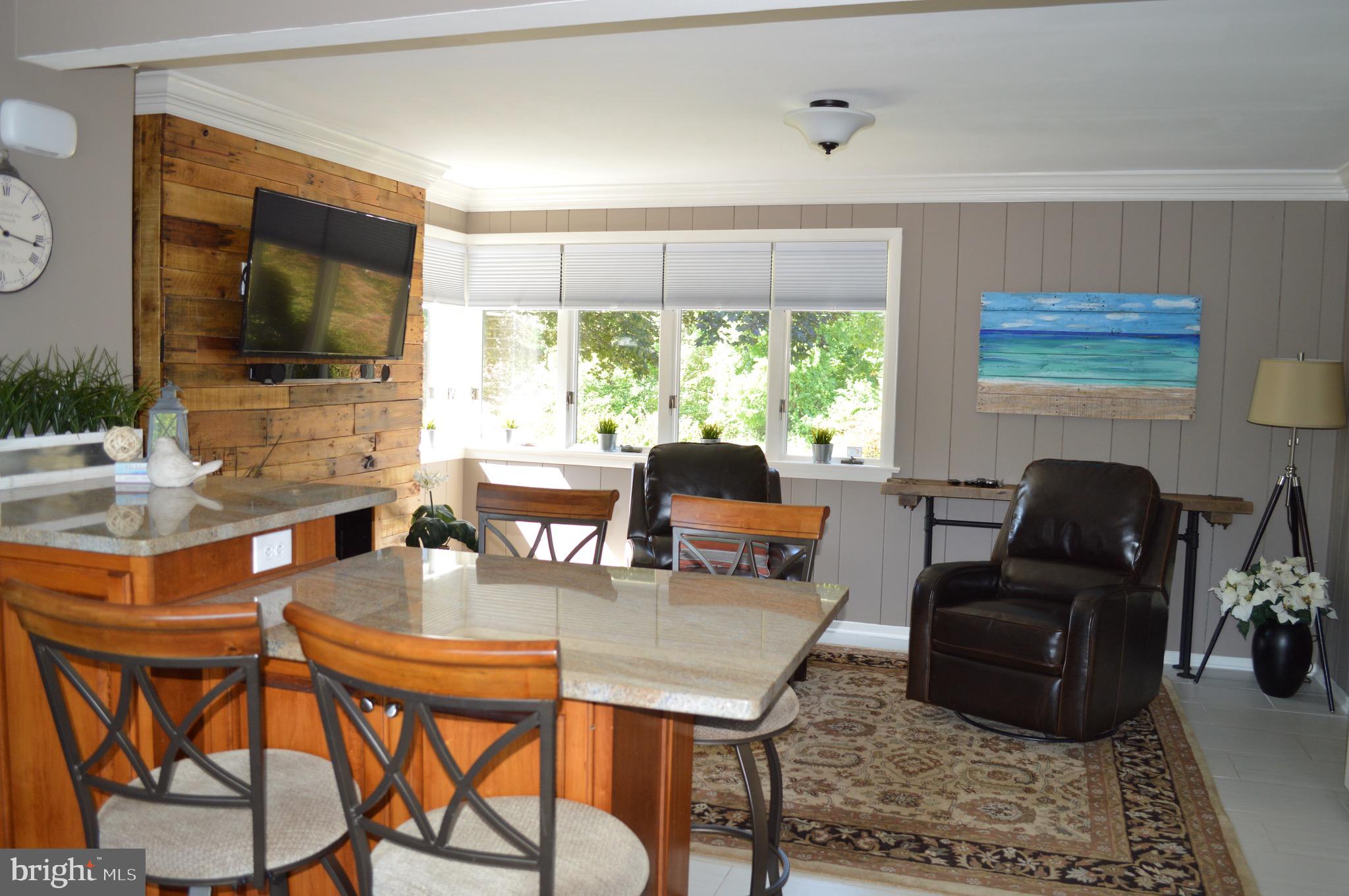 95 Russell Road Phoenixville, PA 19460 - Photo 5 of 37 Breakfast bar, kitchen with wood fireplace