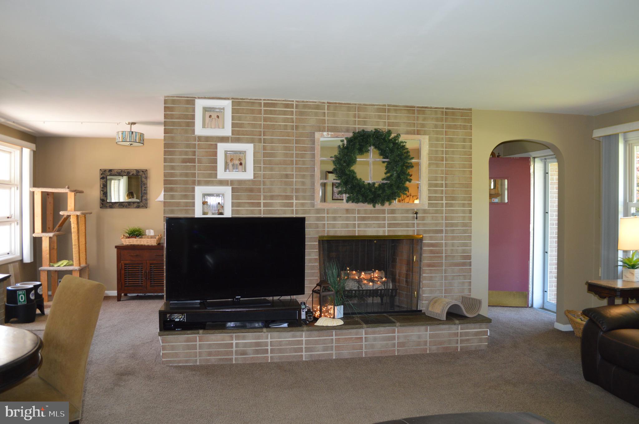 95 Russell Road Phoenixville, PA 19460 - Photo 9 of 37 Living room with wood burning fireplace