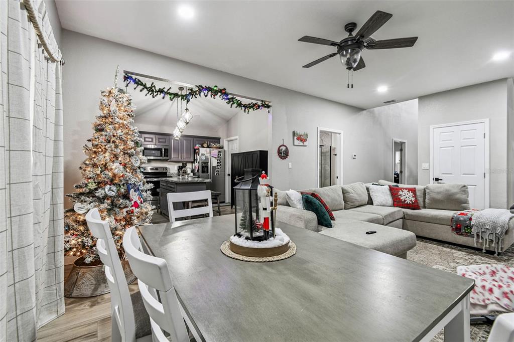 748 McClellan Road Frostproof, FL 33843 - Photo 22 of 31 a living room with furniture and kitchen view